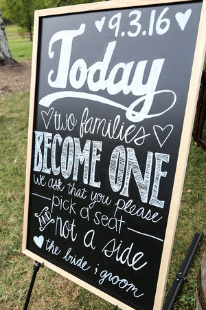 Wedding photography, a hand-made sign welcoming guests to the ceremony. 