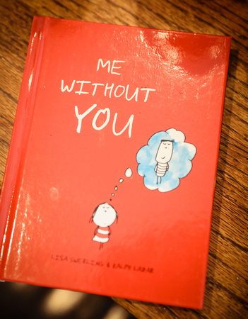 Wedding photography, a shiny red book, "Me Without You." 
