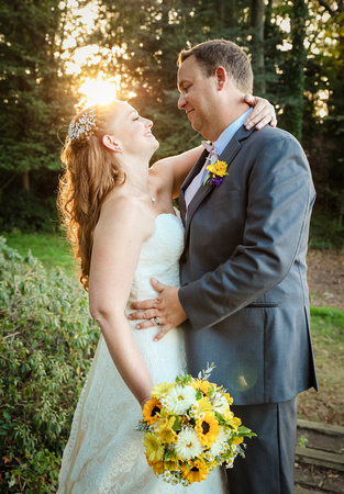 Wedding photography, the bride and groom stare in each other's eyes at sunset. 
