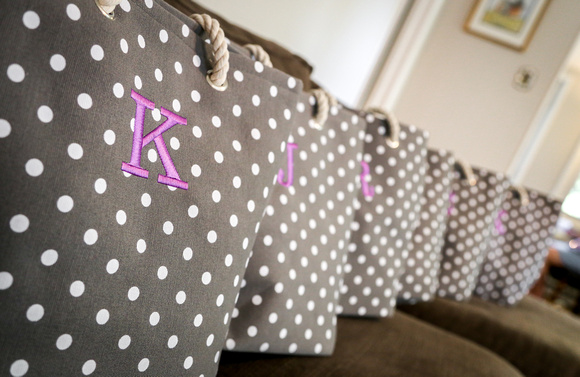 Wedding photography, taupe and white polka dot colored bags with lavender lettering.  
