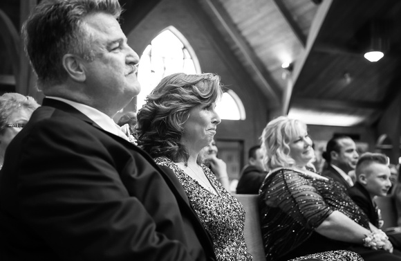 Wedding photography, parents with tears in their eyes watch their children get married. 
