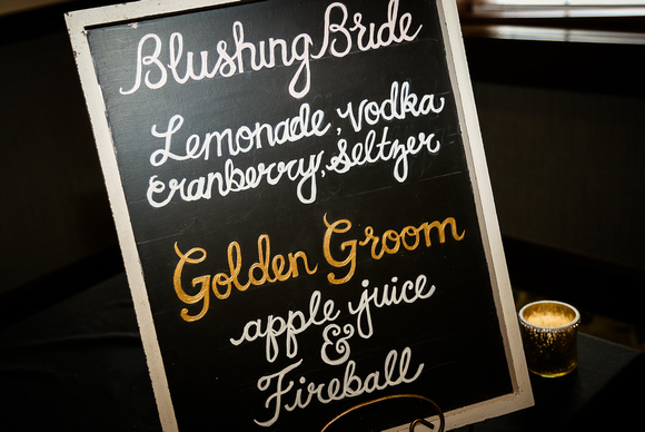 Wedding photography, a hand-made sign describing the speciality cocktails. 