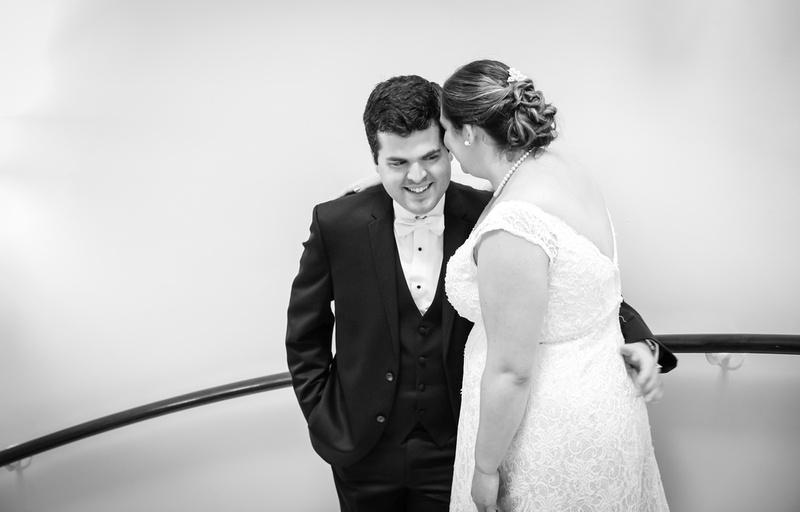 Wedding photography, a bride whispers in her groom's ear 