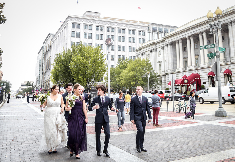 Wedding photography, a wedding party walks through the streets of DC. 
