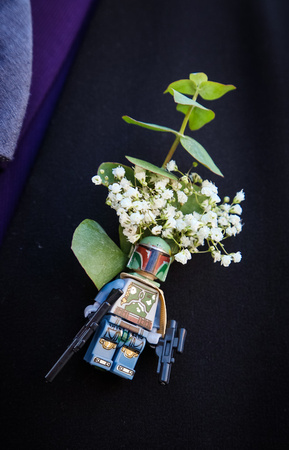 Wedding photography, a Star Wars boutonniere pin with babies' breath.  