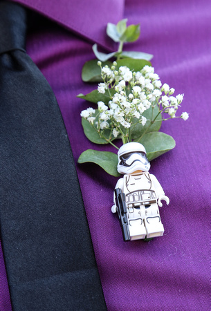 Wedding photography, a boba fett boutonniere pin with babies' breath. 