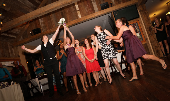 Wedding photography, the ladies jump for the  bouquet. 