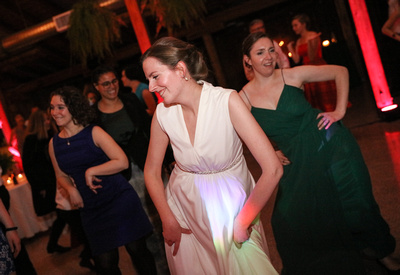 Wedding photography, the bride dances with her friends in green dresses. 