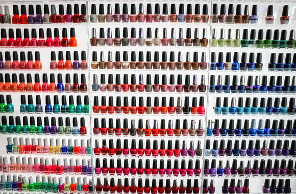 Wedding photography, a wall of colorful nail polishes. 