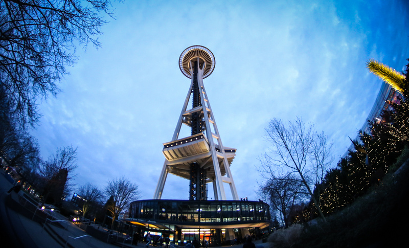 Wedding photography, fisheye lens photo of the Seattle Space Needle at nighttime. 