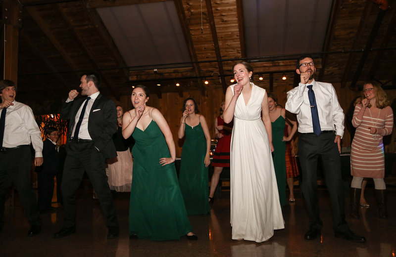 Wedding photography, the wedding party does a choreographed dance. 