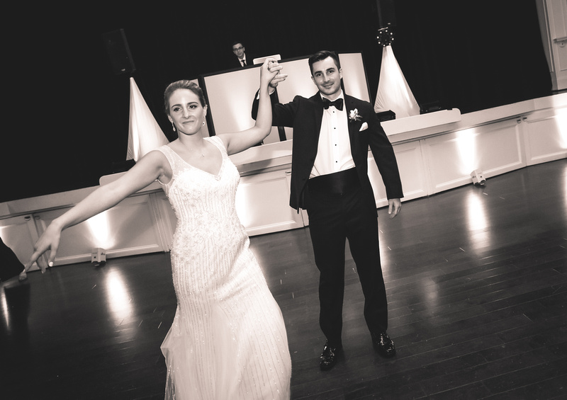 Wedding photography, a bride and groom show off some dance moves. 