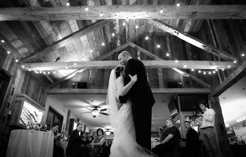 Wedding photography, the bride and groom embrace on the dance floor. 