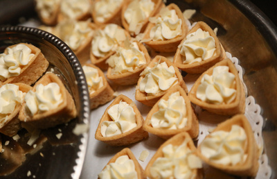 Wedding photography, a close up of pastries with white cream. 